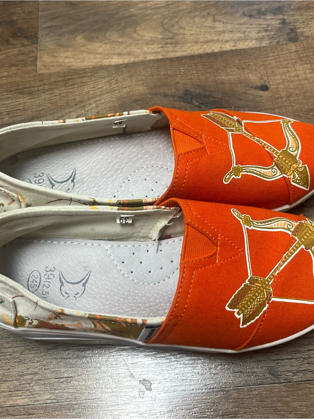 Women’s Orange Slip-On Flats with Archer Graphic